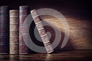 Old books on a library shelf background