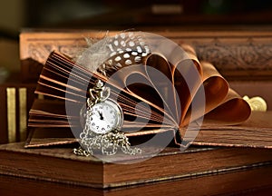 Old books and pocket watch