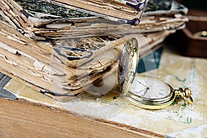 Old books and pocket watch