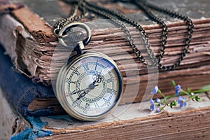 Old books and pocket watch