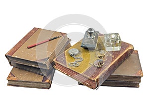 Old books with pocket watch, presse papier and glasses