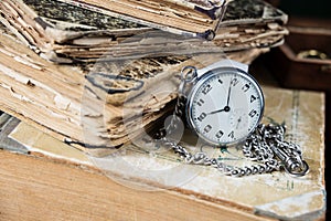 Old books and pocketwatch