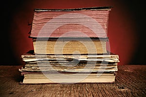 Old books on a rustic wooden table photo