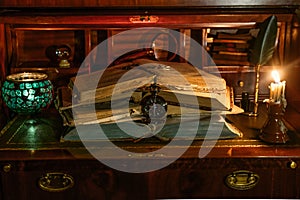 Old books stacked with a pocket watch