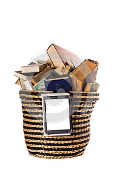 Old books in a trash can and an e-book as a symbol of new technologies. White background, space for text