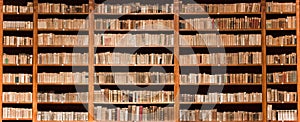 Old books in wooden bookcase