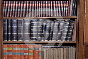 Old books in wooden row library