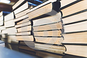 Old books on wooden shelf