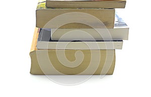 Old books on a wooden shelf