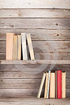 Old books on a wooden shelf