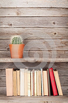 Old books on a wooden shelf