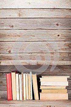 Old books on a wooden shelf