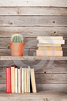 Old books on a wooden shelf