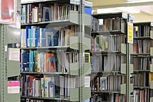 Old bookshelf with books arranged neatly in a wide variety of large libraries..