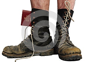 Old boots with legs with money and passport
