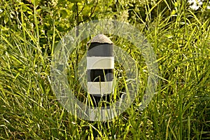 Old border post canceled border in the grass