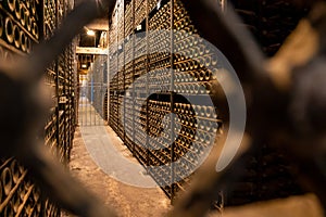 Old bottles of red rioja wine in cellars, wine making in La Rioja region, Spain