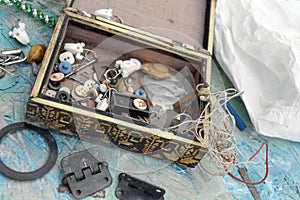 Old box with scattered old unwanted small things