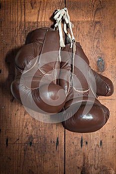 Old Boxing Gloves, hanging on wooden wall