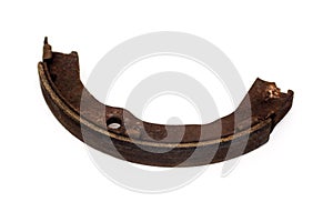 Old brake pads must be replaced on an isolated white background.