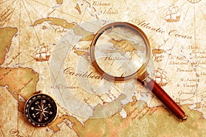 Old brass compass on a Treasure map