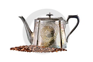 Old brass kettle and coffee beans on white background
