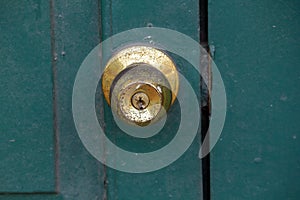 Old brass knobs on the green door