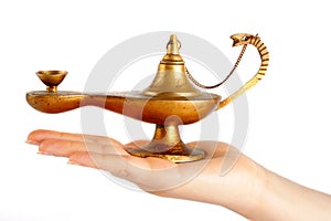 Old brass oil lamp on the hand
