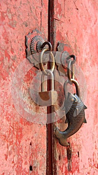 Old Brass Padlock On Old Pink Door