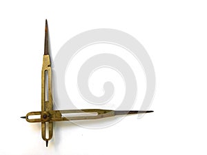 Old brass reduction compass or proportional scale divider. Geometry tool used to scale designs.