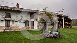 Old Bresse farmhouse with a well in the yard