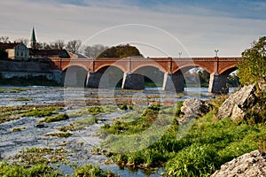 Old brick bridge over river Venta photo