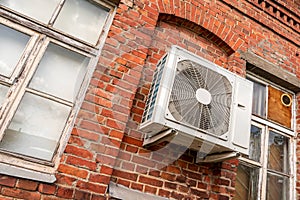 Old brick building with air conditioning unit