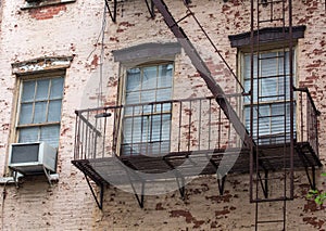 Old brick building with fire escapes in front, Manhattan, New Yo