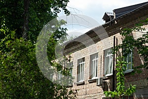 Old brick building with white windows