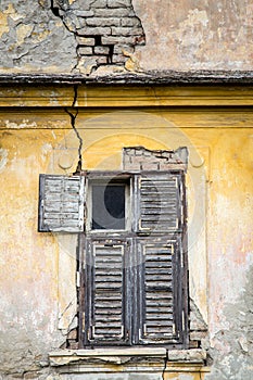 Old brick building with wooden window