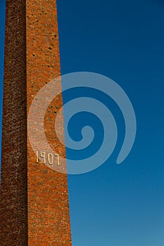 Old brick chimney with 1907