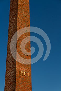 Old brick chimney with 1907