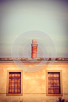 Old brick chimney isolated on sky with copy space