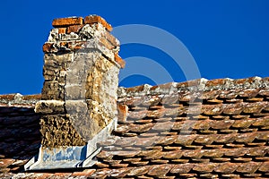 Old brick chimney and roof