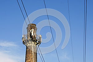 Old brick factory chimney against the sky