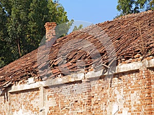 Broken roof of an old brick house