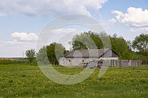Old brick house in the field in Belarus