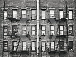 Old brick house with fire escapes, New York, USA