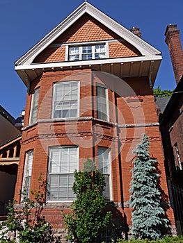 Old brick house with large gable photo