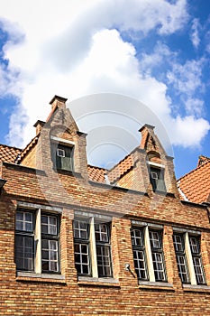 Old brick houses and blue sky in Bruges, Belgium