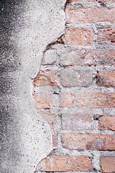 Old brick texture with decayed patterns on urban concrete wall for background