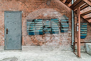Old brick wall with antique mailboxes