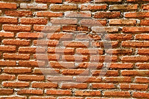 Old brick wall background , brick wall texture , old broken brick , cement joints , close-up