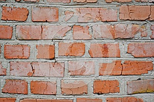 Old brick wall in a background image. Grungy Wide Brickwall. Grunge Red Stonewall Background. Shabby Building Facade